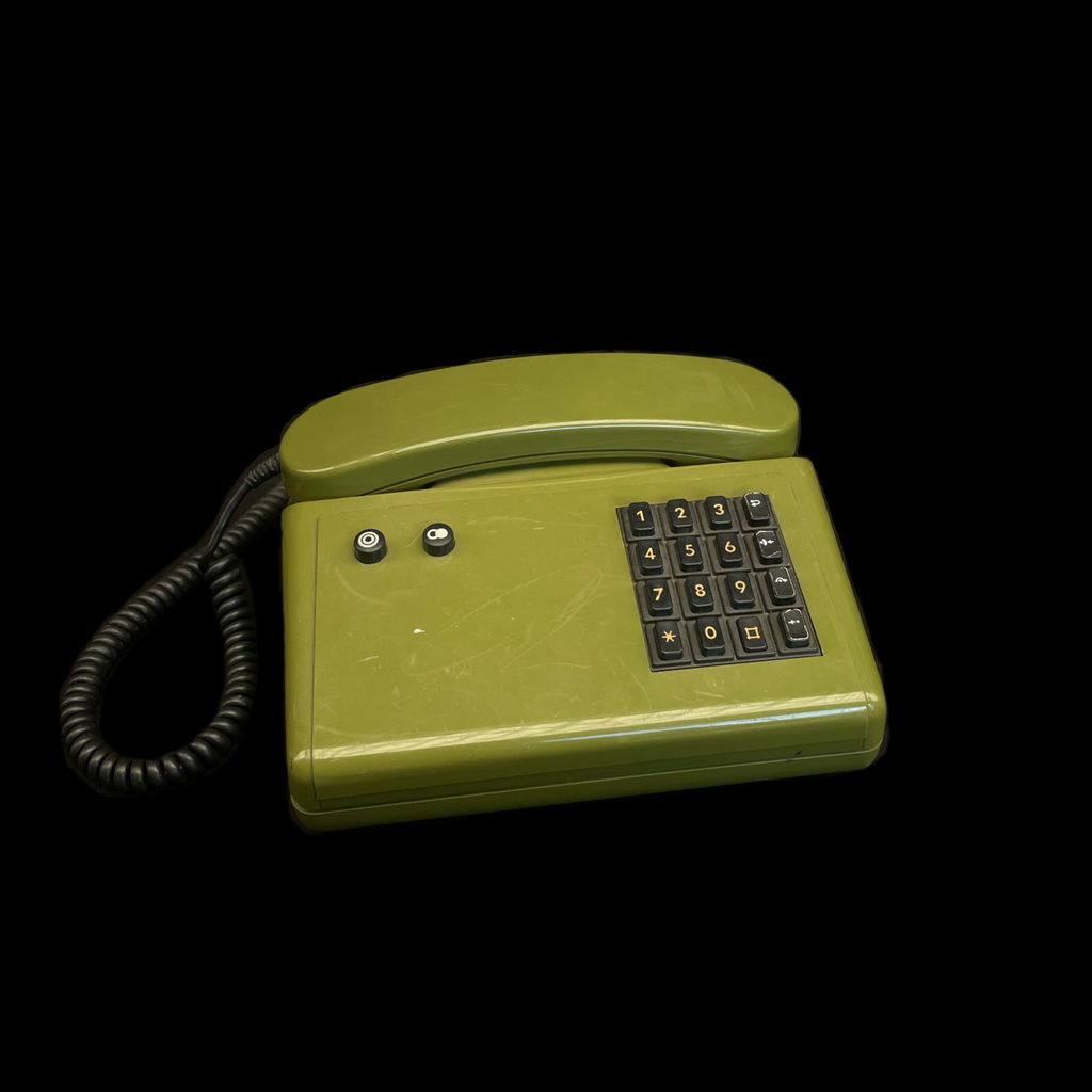 grünes altes Tischtelefon mit Tastenwahlfeld