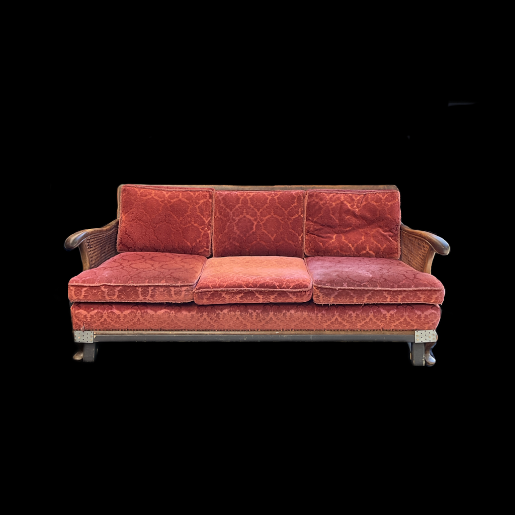 Sofa Rattan mit roten Polstern