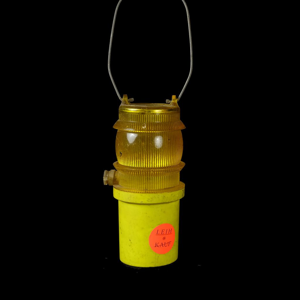 kleine gelbe Baustellenlampe mit Griff